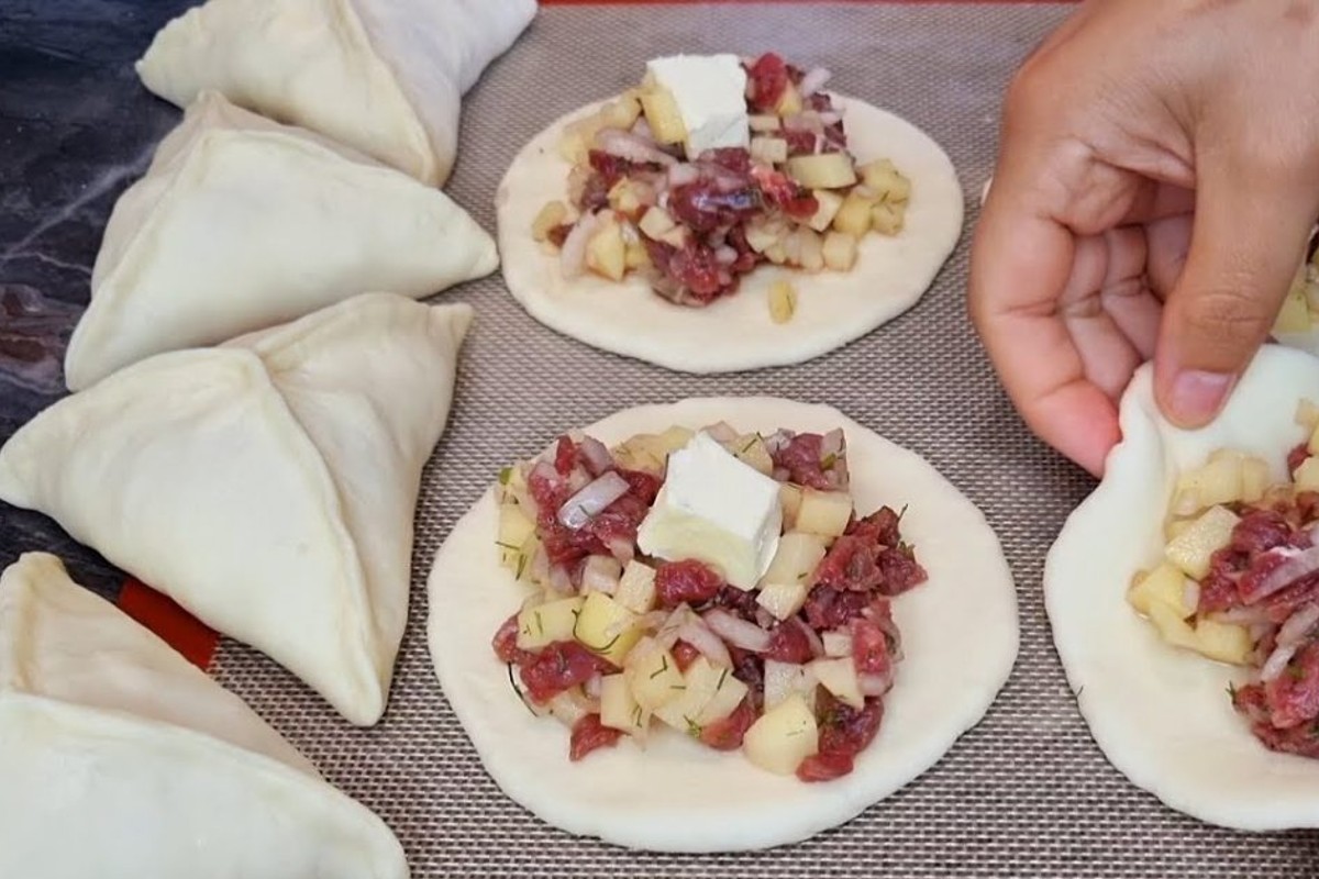 si mangiano in un sol triangolini ripieni